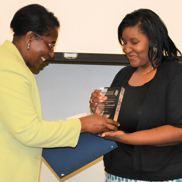 Kiticia Hayes receives the University Award for Excellence in Performance
