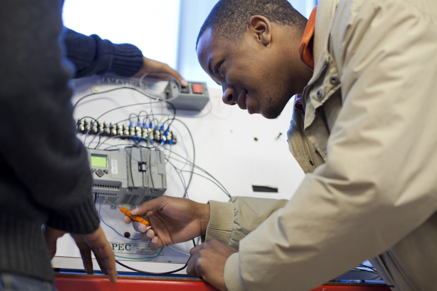 student examining technology