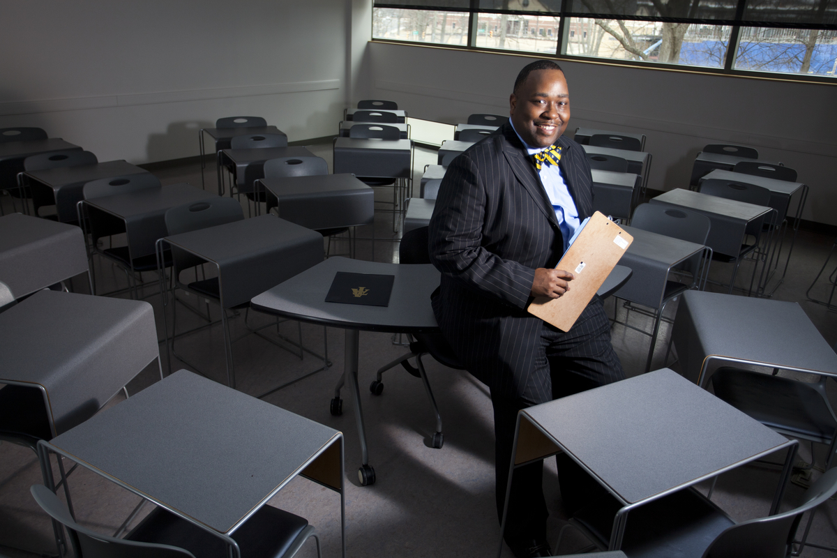 an a and t professor smiles for the camera