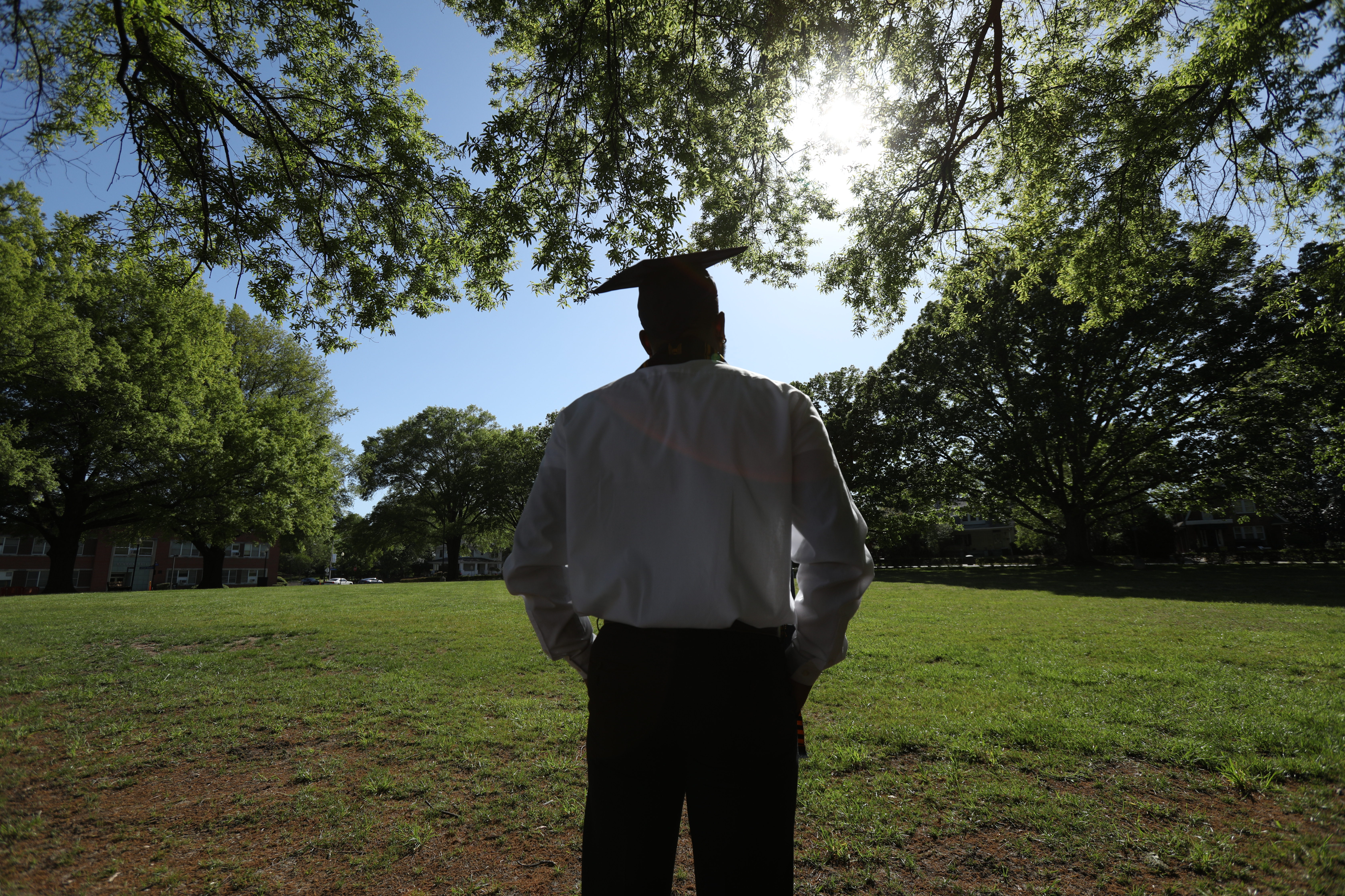 a student has a reflective moment on the a and t campus