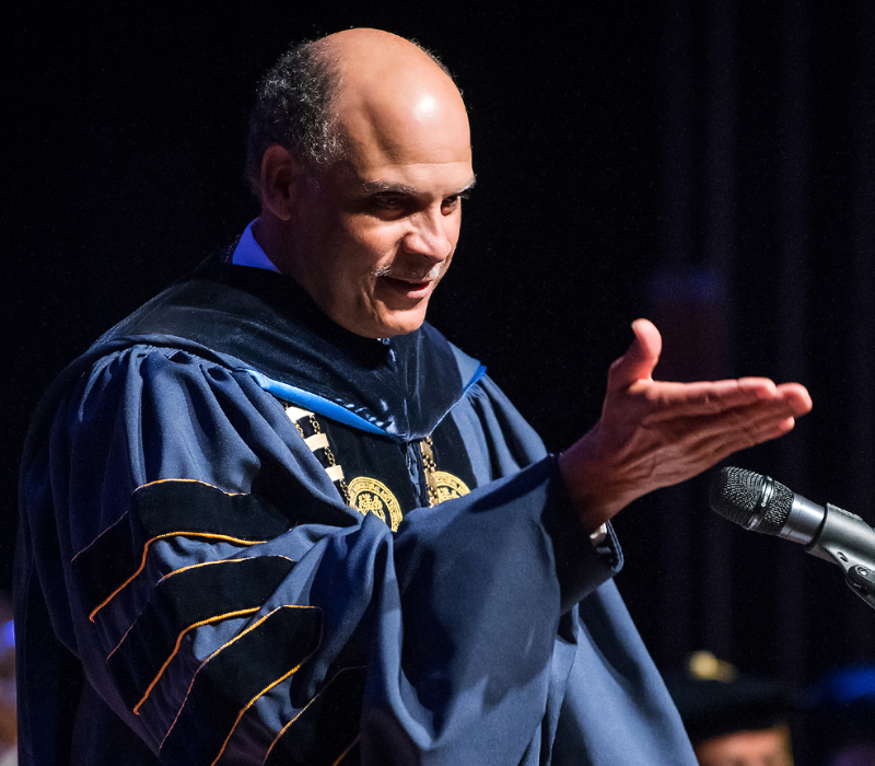 Chancellor Martin gesturing at commencemnt