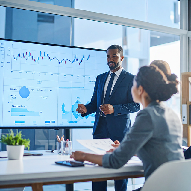 Class being taught with graphs on the board.