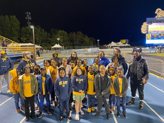 Aggie Academy students were recognized at the football game against Bryant University