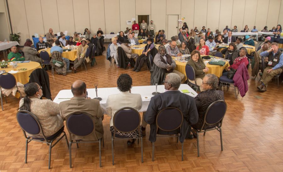 A group of people sitting around a table.