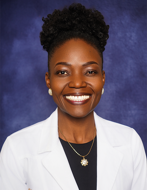 Dr. Abla Afatsawo in a professional photo in a lab coat 