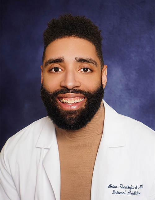Dr. Brian Shackleford in a  professional photo in a lab coat