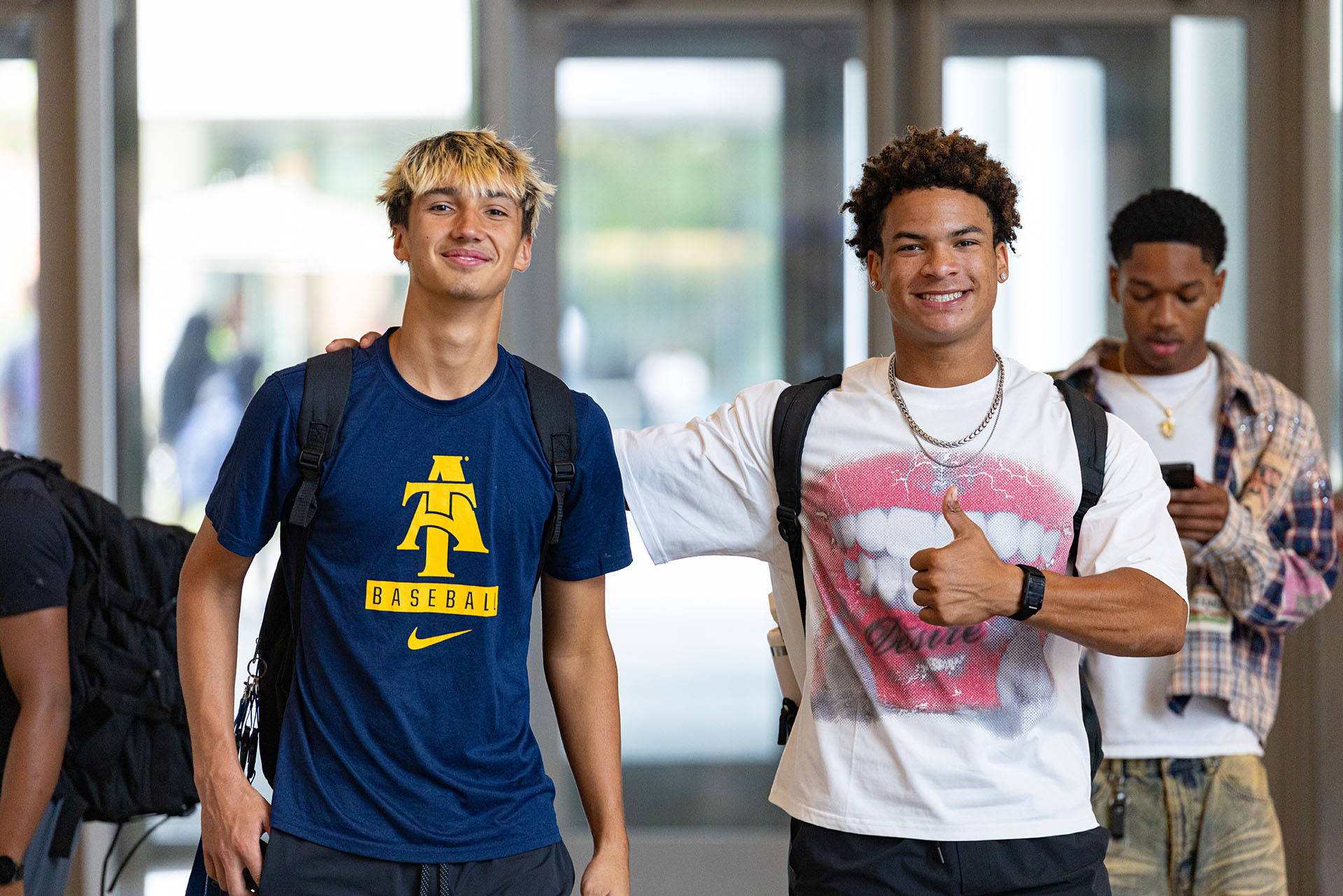 Students smiling lobby on first day of class