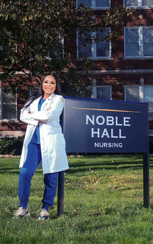 Female Nursing student in white lab coat