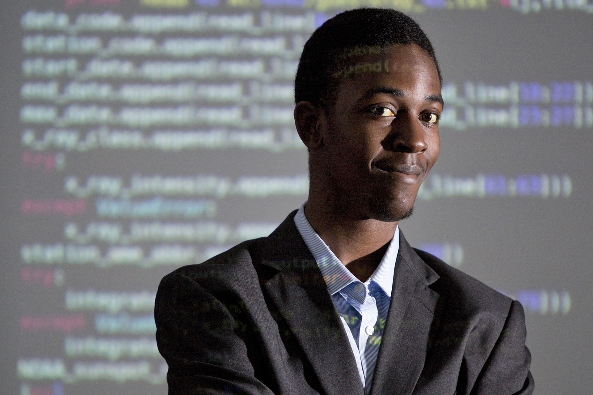 black male smiling in suit