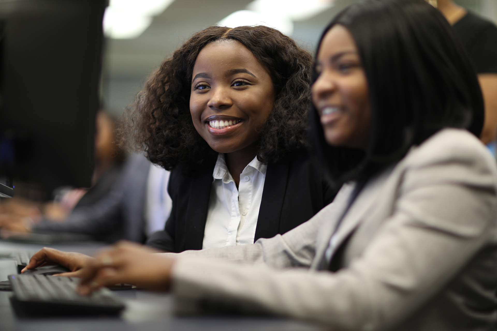 Two female students at computer