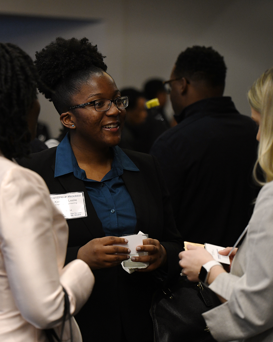 A student networks during engineers week conversation