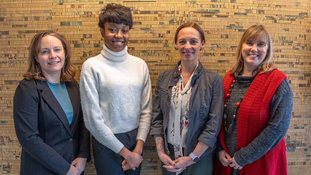 Image of Kayla gore and memebers of her work group
