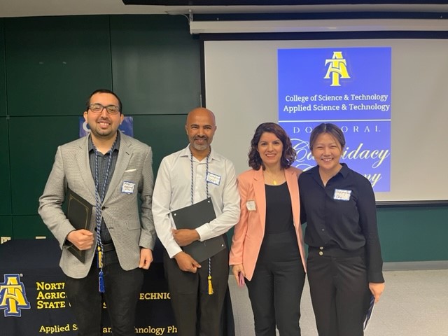 Mehdi Lamassil and Tewodros Gebre with Dr. Dongyang Deng and  Dr. Leila Hashemi-Beni