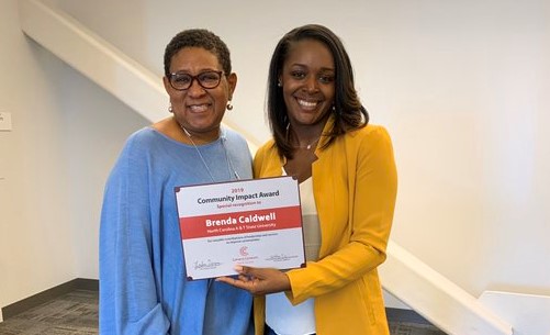 Student receiving leadership award