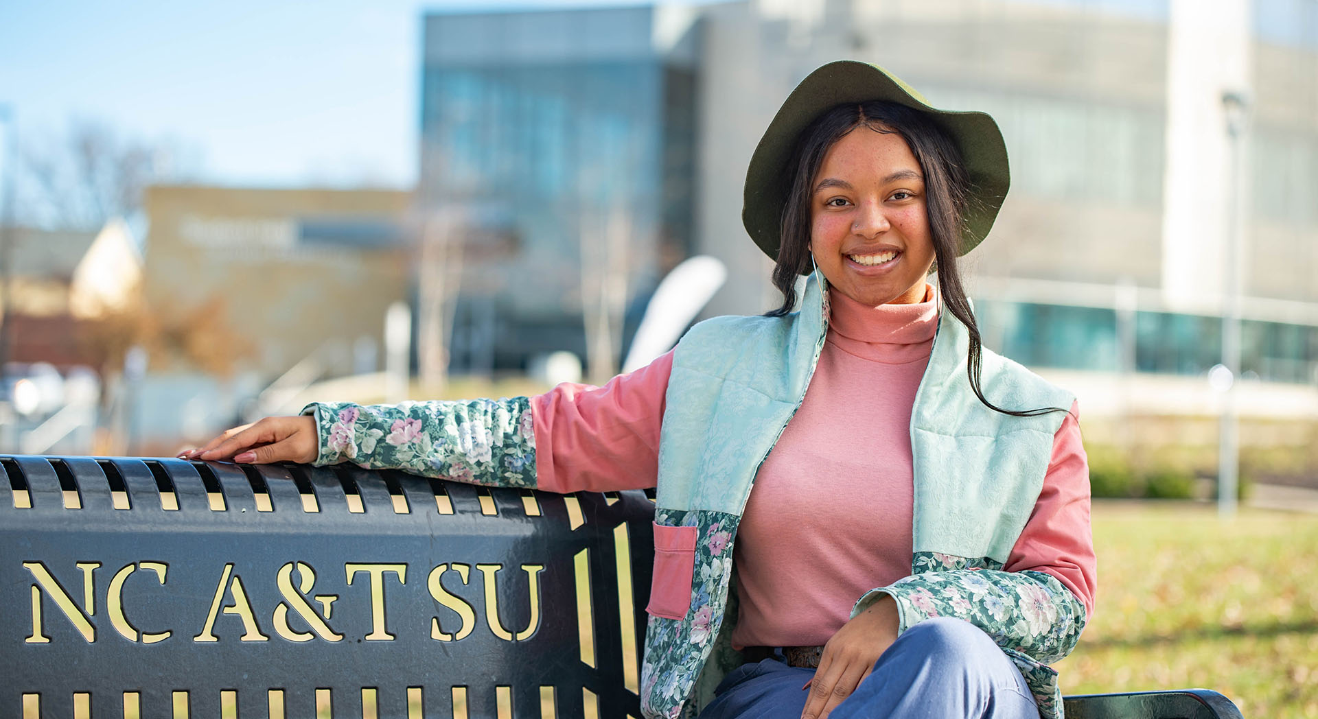Student sitting on a bench