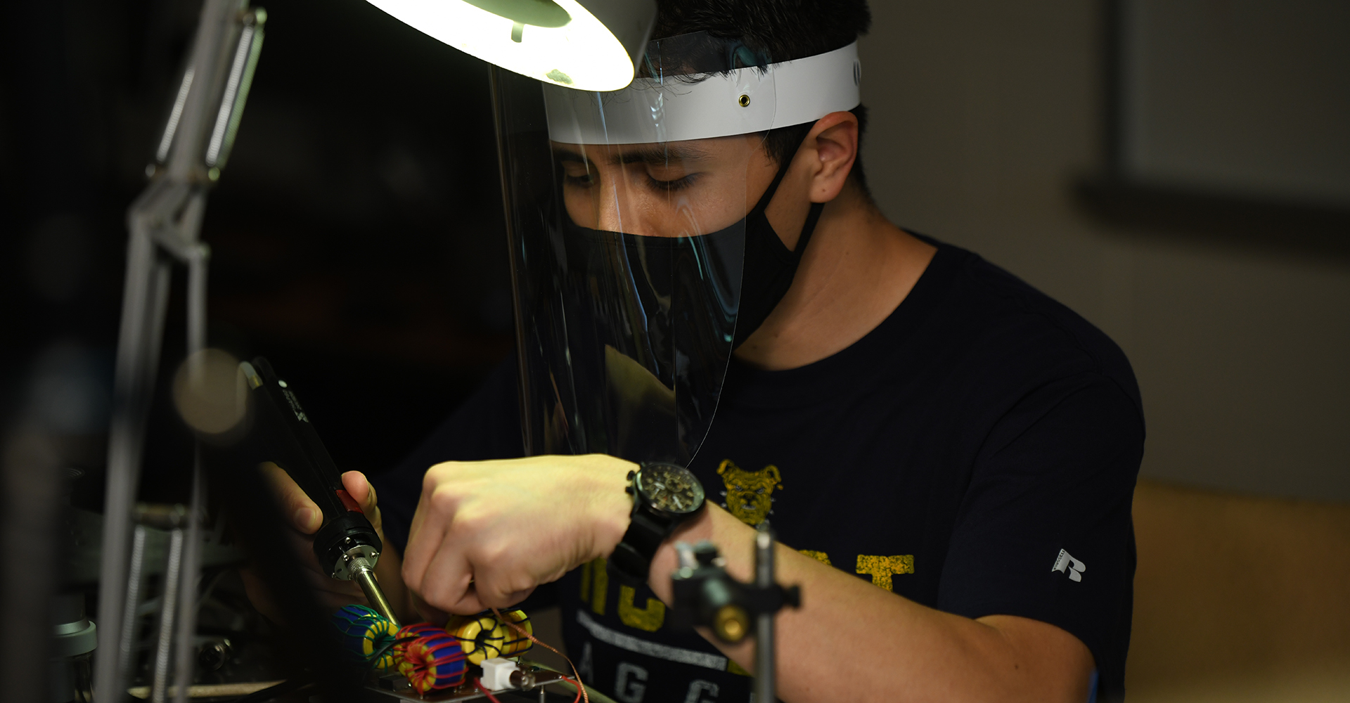 This is a photo of a student in the ECE lab.