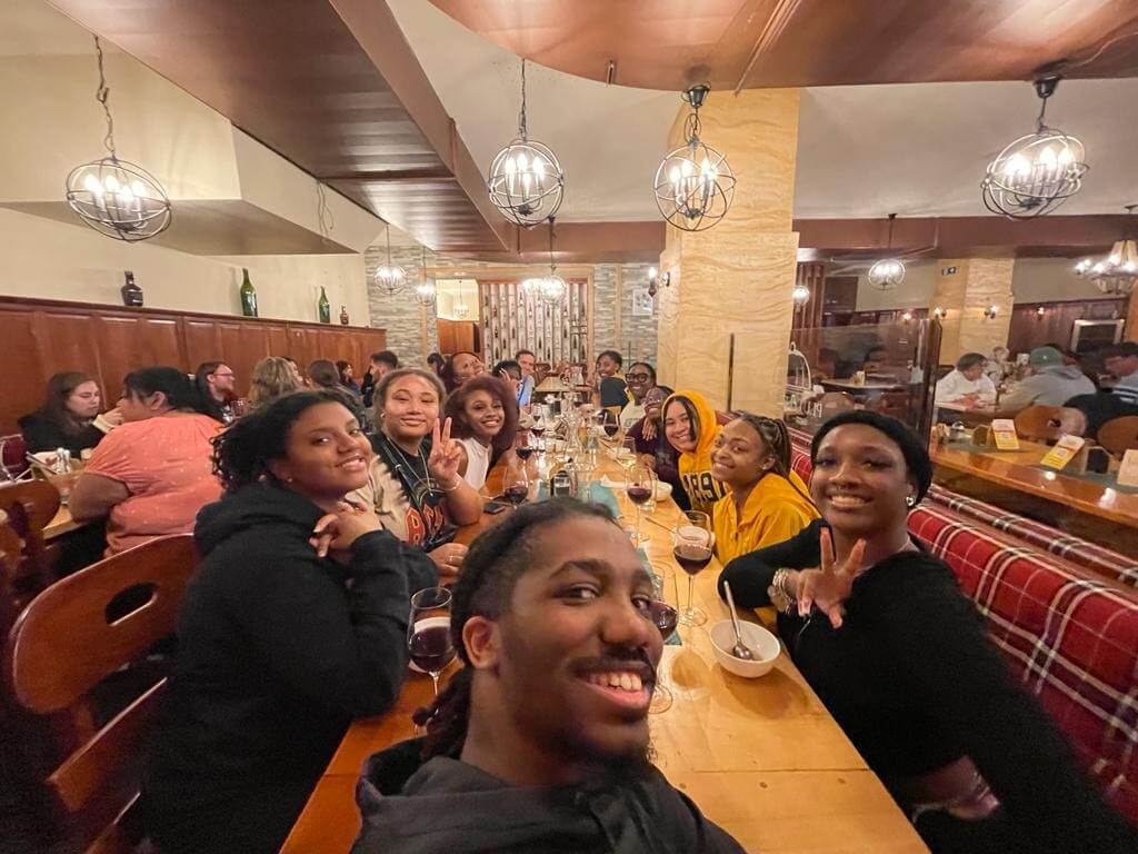 Psychology students' selfie at restaurant during study abroad