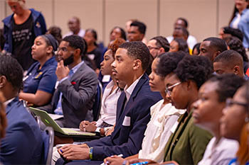 Students listen to presentation