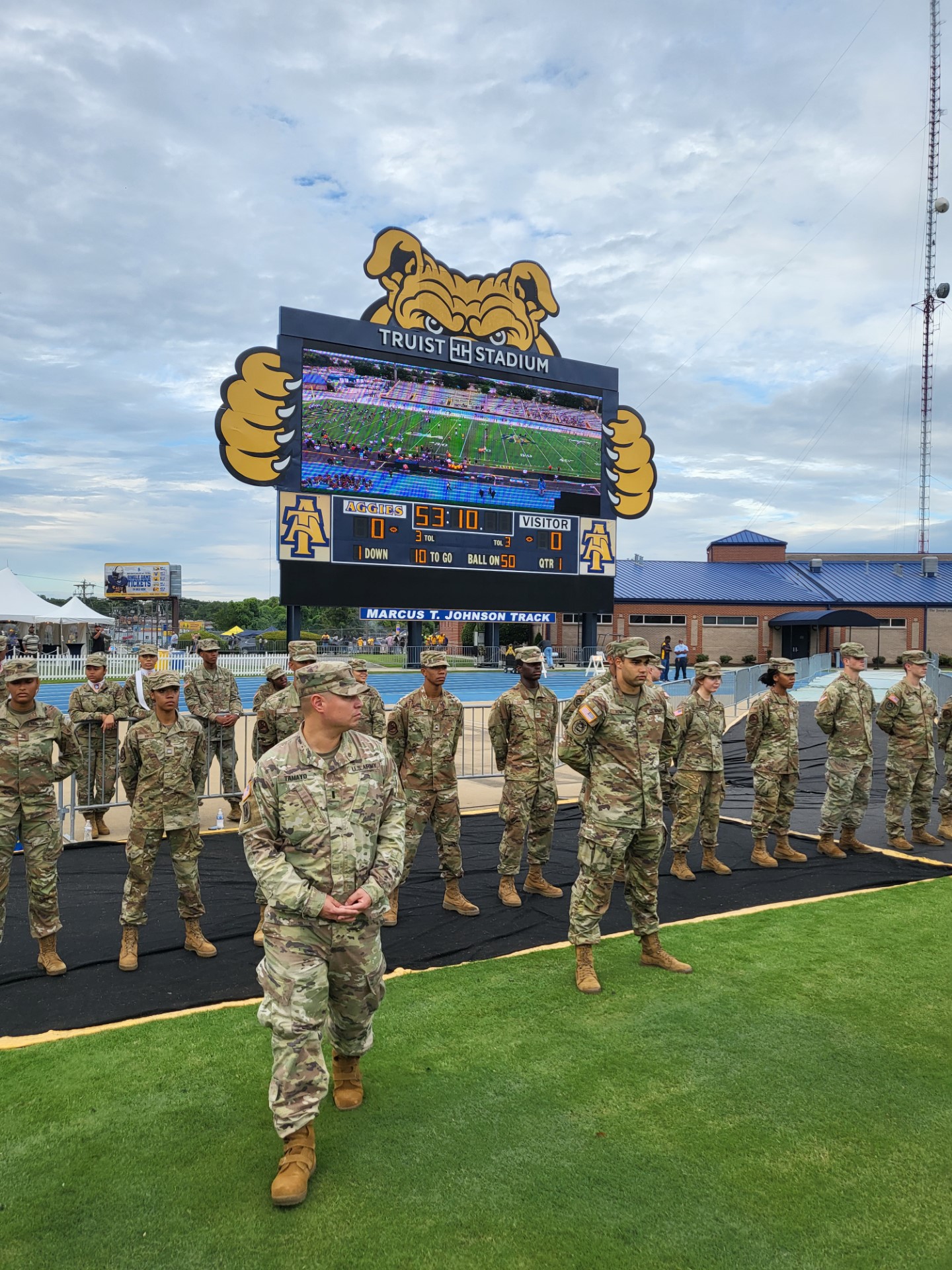 Aggie Cadets in camouflage on the football field